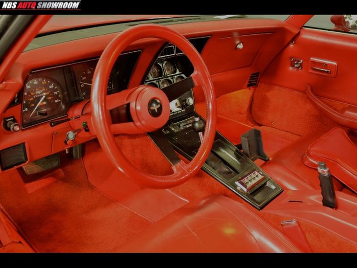 Blood red interior covered with leather and thick material - it must be comfortable here