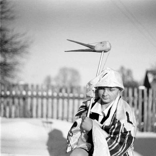 Belarus / Pagost / 10.01. 2009 /
A girl in stork's costume posses during the traditional Koliadki holiday in the Belarus village of Pagost, (300 km from Minsk), on Saturday, 10 January 2009. Koliadki refers to many of the pre-Soviet Era Christmas traditions. Fancy dressed people go from house to house, singing, dancing, eating and drinking. The hosts will give money or food to their guests as a sign for them to leave the house.
© Andrei Liankevich / Anzenberger