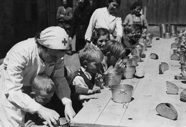 1945: Slovak Red Cross nurses feeding orphans during World War II.