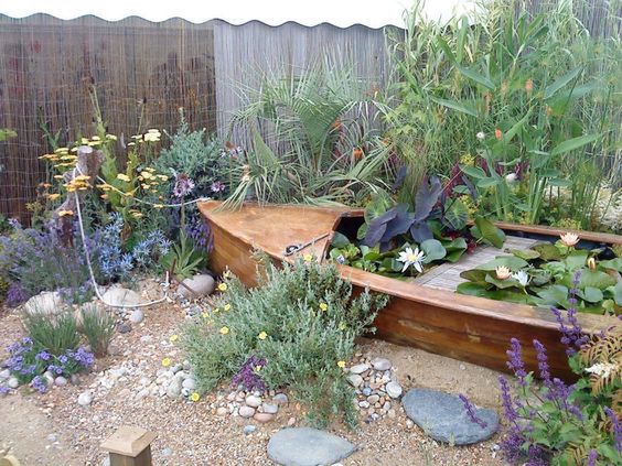 An Old Bathtub Saved From Dumping and Converted Into a Fantastic Garden  Decor