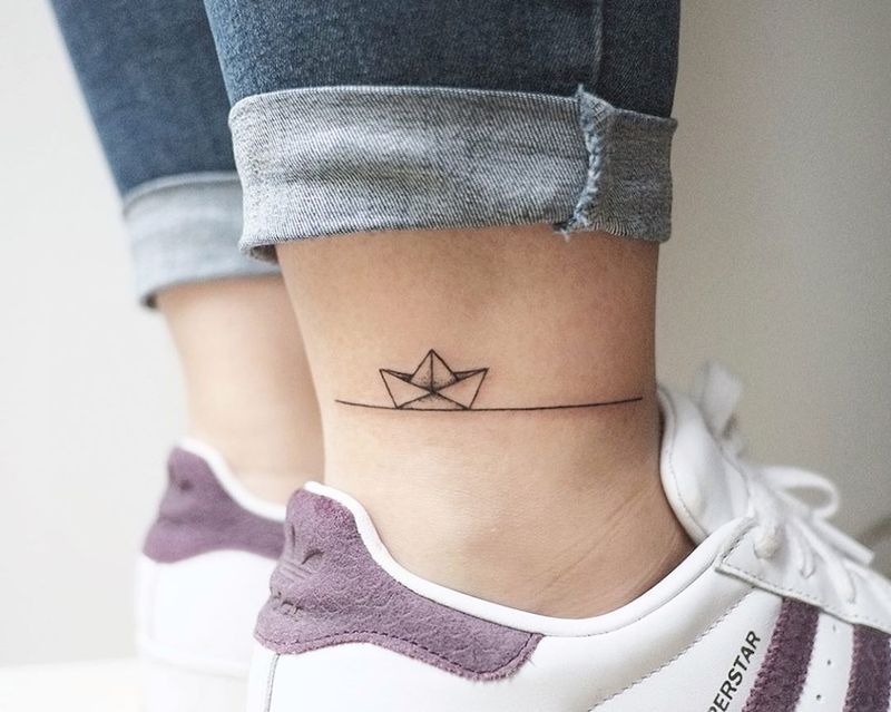 Open Mind Tattoo Club - Origami little boat tattoo by our artist  @anastasios.openmindtattoo . Always using legendary butter and legendary  foam by @urbanlegendtattooaftercare and @urban_legend_pc #origamitattoo  #origami #boattattoo #paperboattattoo ...