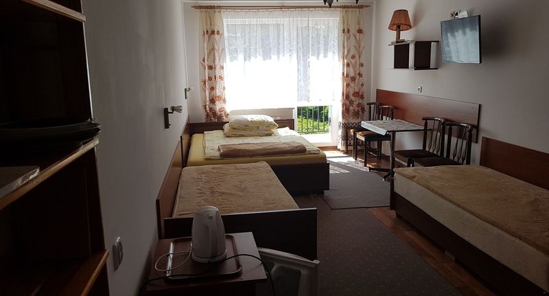 Pokoj pro 4 os. s výhledem do zahrady přízemní - Pokoje U Henryki Kołobrzeg, foto 1