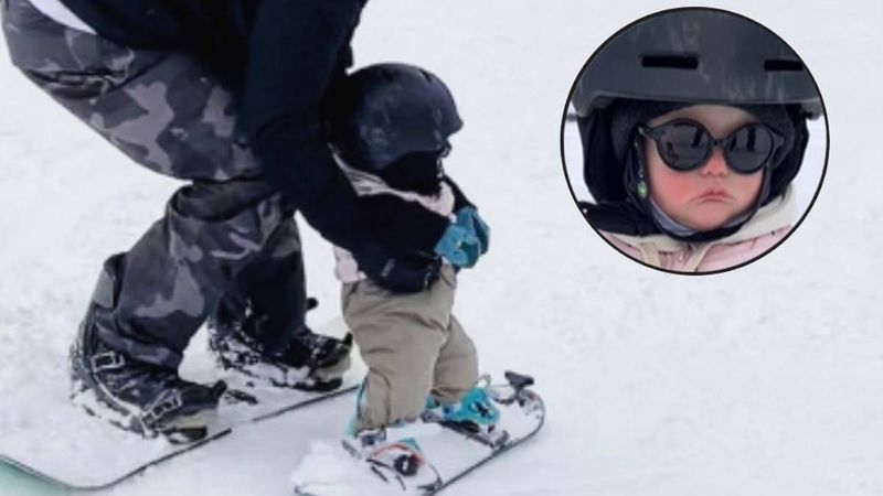 11-miesięczna dziewczynka jeździ na snowboardzie