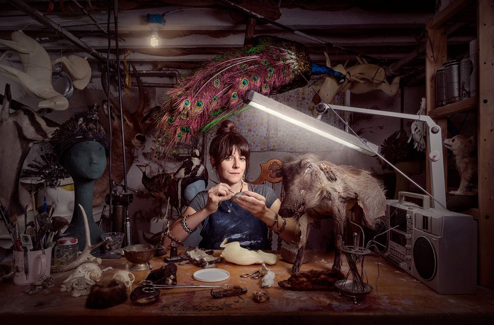 Pomysł na zrealizowanie serii portretów "Women’s Work” przyszedł do głowy Chrisa Crismana podczas lunchu z jego przyjaciółmi z Nowego Jorku. W 2016 roku spotkał się m.in. z Emily Heller, która opowiedziała mu pewną historię.