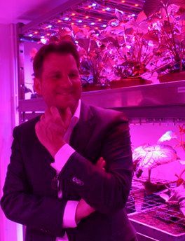 Gertjan Meeuws of PlantLab, a private research company, smiles during an interview with The Associated Press in a lab where he is growing herbs and vegetables under LED lights in Den Bosch, central Netherlands, Thursday, March 24, 2011. Farming is moving indoors, where the sun never shines, where rainfall is irrelevant and where the climate is always right The perfect crop field could be inside a windowless building with meticulously controlled light, temperature, humidity, air quality and nutrition. It could be in a New York high-rise, a Siberian bunker, or a sprawling complex in the Saudi desert. (AP Photo/Arthur Max)
