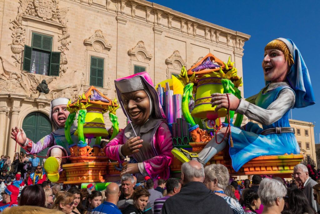 Highly,Colourful,Paper,Mache,Floats,Fill,The,Streets,Of,Valletta
dress,capital,fancy,color,church,float,med,platform,scene,folklo
